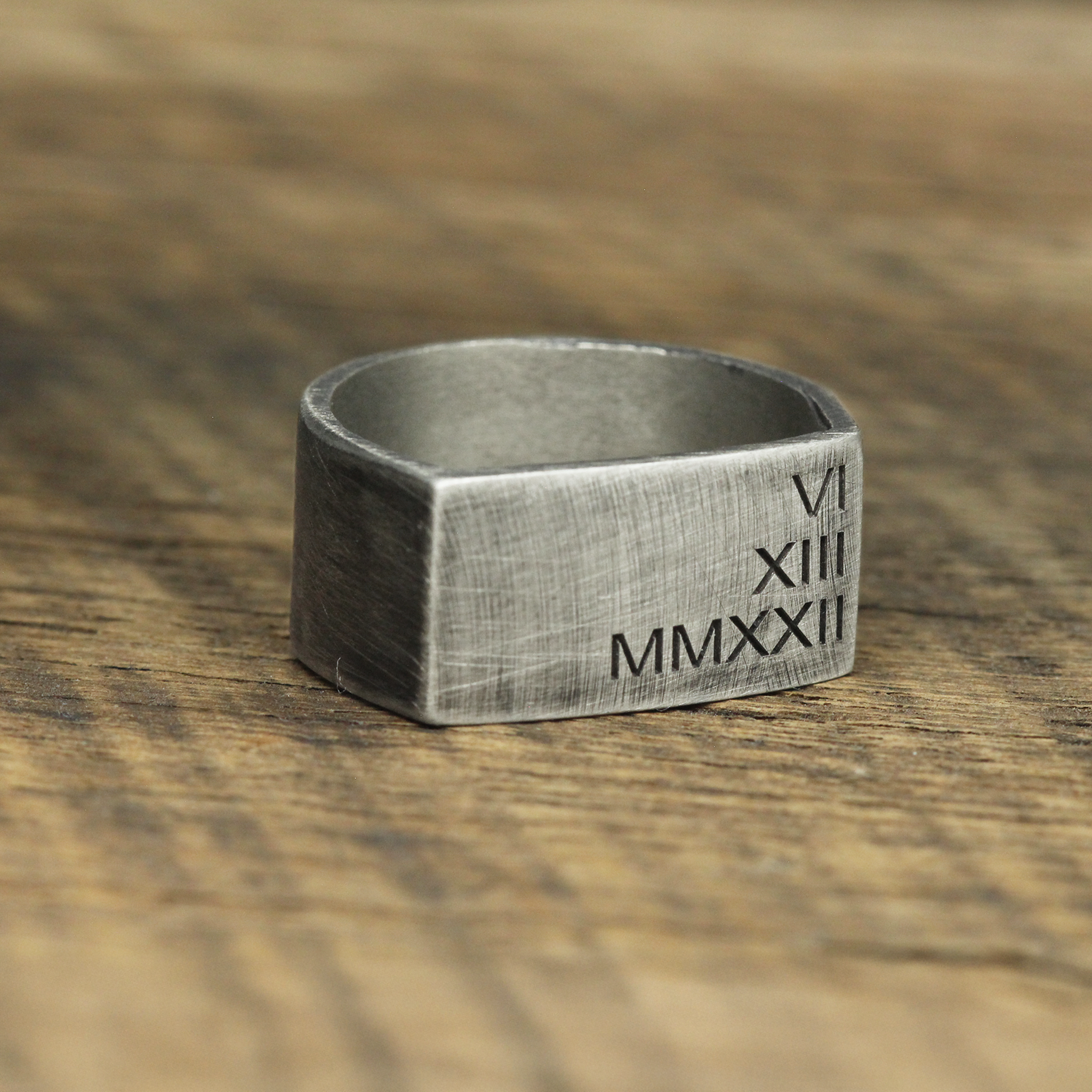 rustic engraved Roman numerals silver wedding band