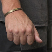 hand stamped gold cuff man