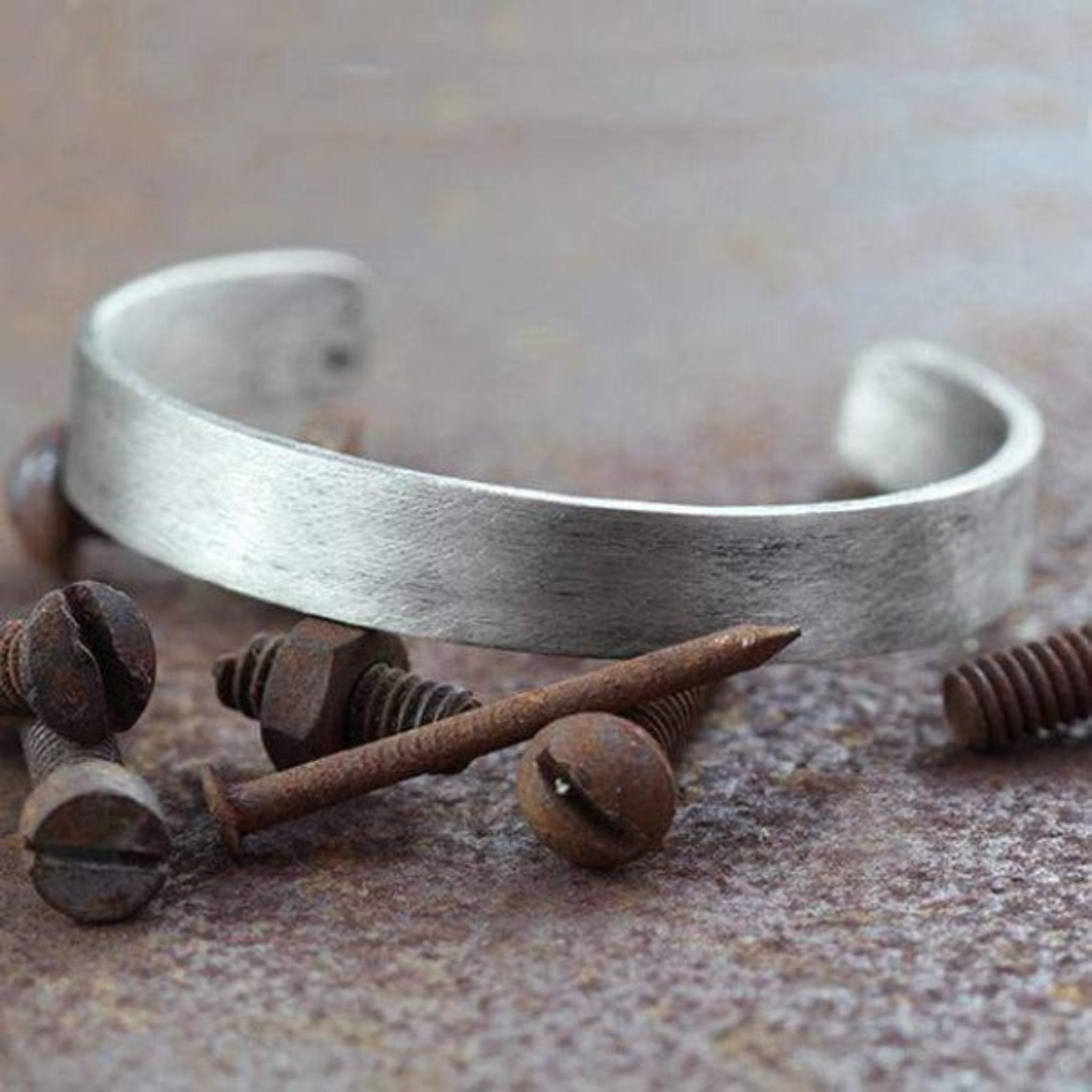 wide silver cuff with Roman numerals